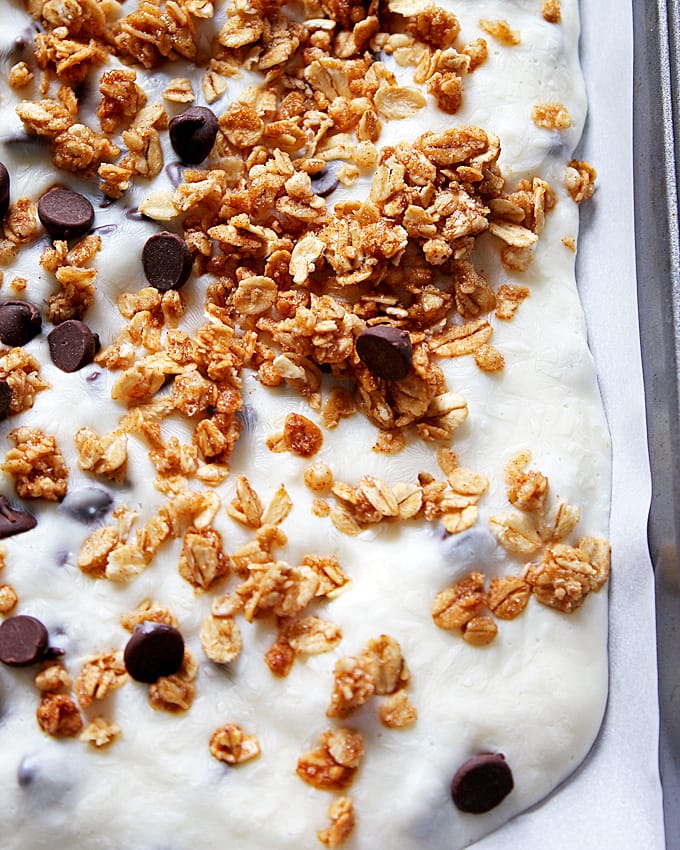 Chocolate chip granola frozen yogurt bark made with non-fat Greek yogurt and honey - the perfect quick snack or breakfast! Whip up a batch and keep it in your freezer. 