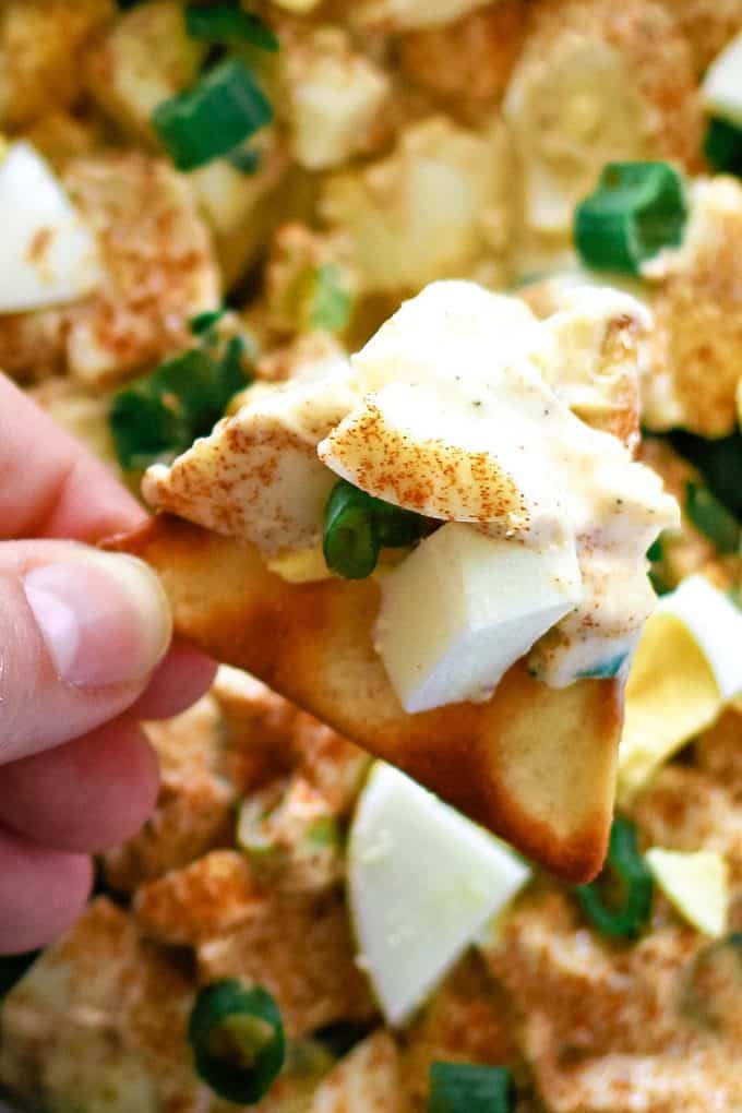 deviled egg dip on a cracker