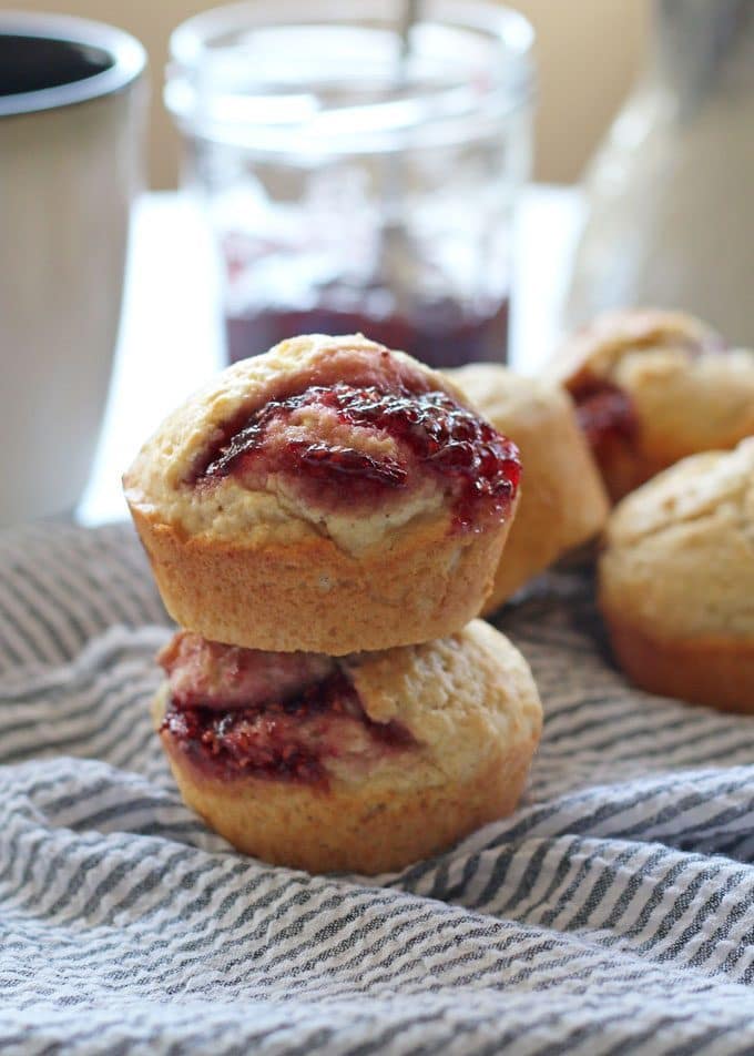 These easy muffins filled with jam are the perfect quick breakfast! I like to eat one or two in the morning with a piping hot cup of coffee. It's such an easy recipe to make that you can make a batch when you wake up. Also, they are perfect for farmer's market preserves and jams! | honeyandbirch.com