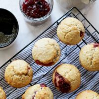 These easy muffins filled with jam are the perfect quick breakfast! I like to eat one or two in the morning with a piping hot cup of coffee. It's such an easy recipe to make that you can make a batch when you wake up. Also, they are perfect for farmer's market preserves and jams! | honeyandbirch.com