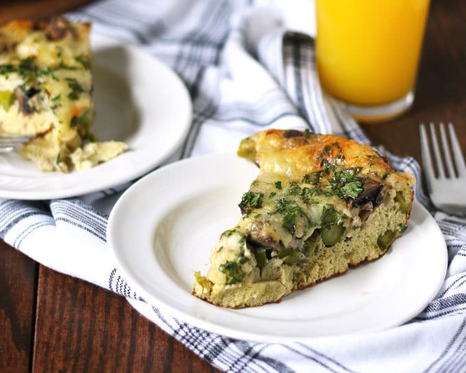 This asparagus mushroom swiss egg bake is perfect for brunch or breakfast! It can be prepared overnight and most of the cooking is done in the oven. Consider making this easy recipe your go to Mother's Day recipe! | honeyandbirch.com