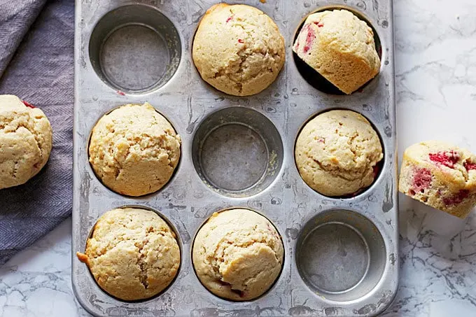 Muffin tin with raspberry lemon muffins