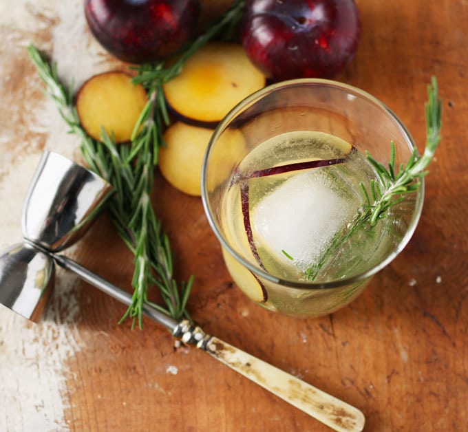 Rosemary's Plum gin cocktail is a blend of fresh ingredients and aromas. Thanks to the addition of fresh plum and St. Germain there is no need to add any additional sugar. Instead, I pair it with gin and rosemary for a fresh and herbaceous drink. | honeyandbirch.com