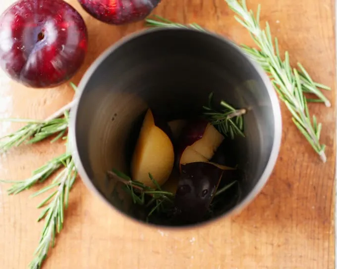 Rosemary's Plum gin cocktail is a blend of fresh ingredients and aromas. Thanks to the addition of fresh plum and St. Germain there is no need to add any additional sugar. Instead, I pair it with gin and rosemary for a fresh and herbaceous drink. | honeyandbirch.com