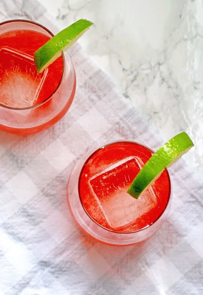 This strawberry rhubarb daiquiri recipe is the perfect spring cocktail! Plus, a recipe for homemade strawberry rhubarb simple syrup. | honeyandbirch.com