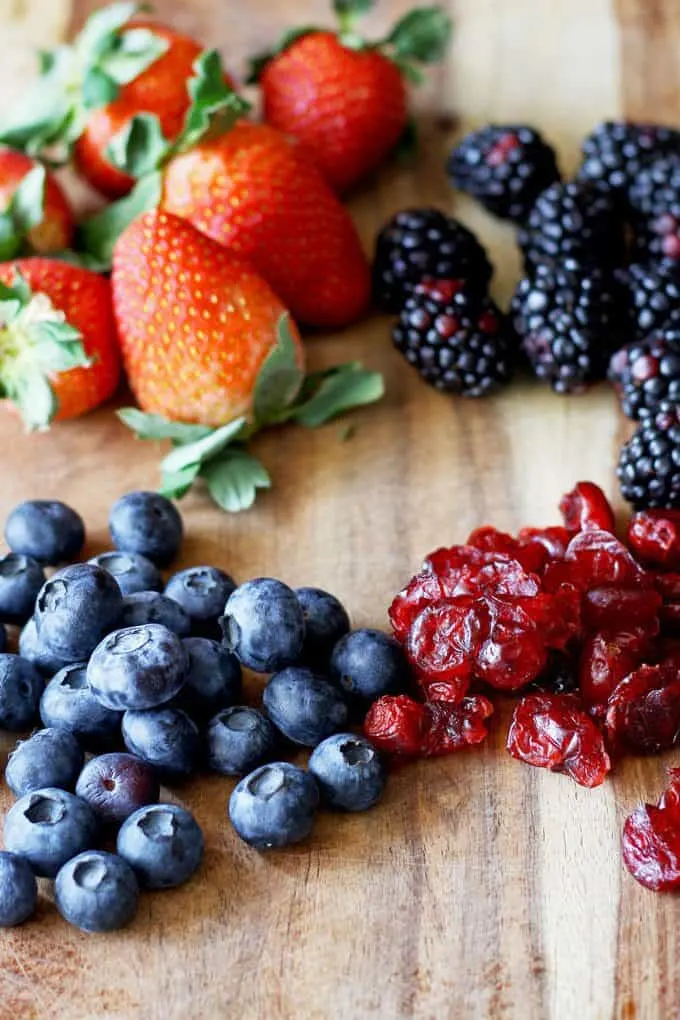 strawberries, blueberries, blackberries and dried cranberries