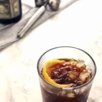 The black stripe cold rum cocktail is a fantastic drink with a surprise ingredient - molasses! If you are looking for something sweeter, add honey; if not, just enjoy the molasses and dark rum all on their own over crushed ice. | honeyandbirch.com