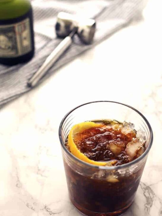 The black stripe cold rum cocktail is a fantastic drink with a surprise ingredient - molasses! If you are looking for something sweeter, add honey; if not, just enjoy the molasses and dark rum all on their own over crushed ice. | honeyandbirch.com