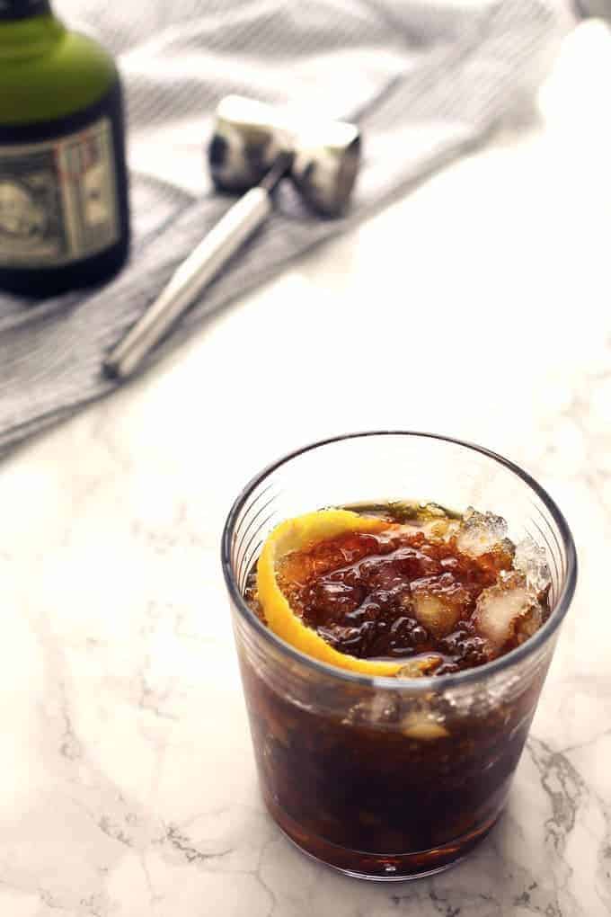 The black stripe cold rum cocktail is a fantastic drink with a surprise ingredient - molasses! If you are looking for something sweeter, add honey; if not, just enjoy the molasses and dark rum all on their own over crushed ice. | honeyandbirch.com