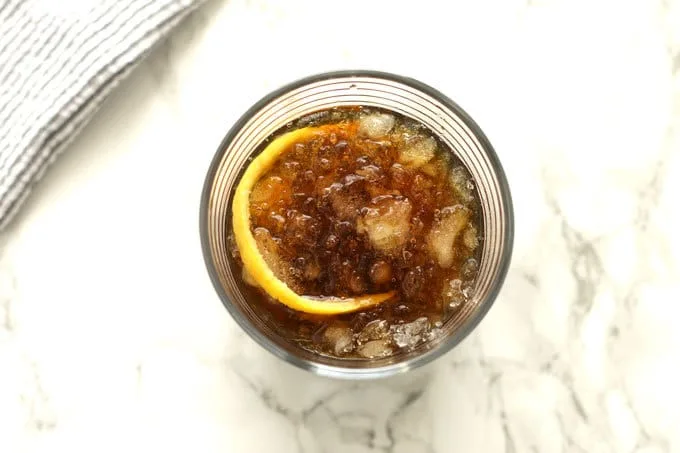 The black stripe cold rum cocktail is a fantastic drink with a surprise ingredient - molasses! If you are looking for something sweeter, add honey; if not, just enjoy the molasses and dark rum all on their own over crushed ice. | honeyandbirch.com