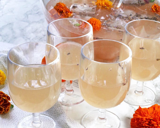 This boozy honey lavender lemonade is a great drink for brunches. It is also the PERFECT punch for spring and summer bridal or baby showers. | honeyandbirch.com
