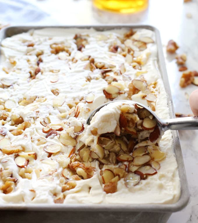 This no churn honey nut ice cream is easy to make and delicious on a hot summer day. Vanilla, almonds, walnuts and honey are perfect additions to 2-ingredient no churn ice cream! | honeyandbirch.com