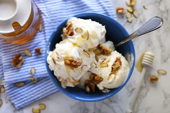 This no churn honey nut ice cream is easy to make and delicious on a hot summer day. Vanilla, almonds, walnuts and honey are perfect additions to 2-ingredient no churn ice cream! | honeyandbirch.com