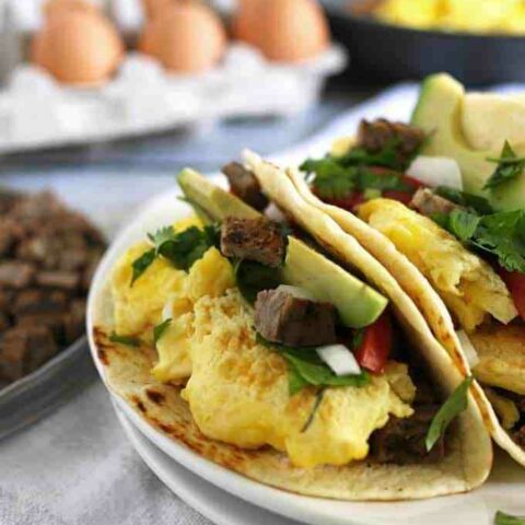 Steak and egg breakfast tacos are a great spin on a traditional diner breakfast. Add your favorite taco toppings! Also great for Father’s Day morning and steak lovers! | honeyandbirch.com
