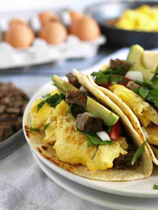 Steak and egg breakfast tacos are a great spin on a traditional diner breakfast. Add your favorite taco toppings! Also great for Father’s Day morning and steak lovers! | honeyandbirch.com