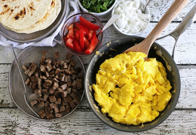 Steak and egg breakfast tacos are a great spin on a traditional diner breakfast. Add your favorite taco toppings! Also great for Father’s Day morning and steak lovers! | honeyandbirch.com