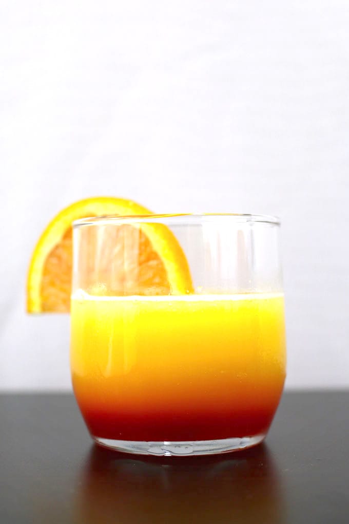 These tequila sunrise slushies are going to be your go-to summer party drink! You can easily multiply the recipe for a pitcher. Only 3 ingredients! | honeyandbirch.com