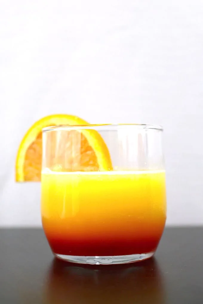 These tequila sunrise slushies are going to be your go-to summer party drink! You can easily multiply the recipe for a pitcher. Only 3 ingredients! | honeyandbirch.com