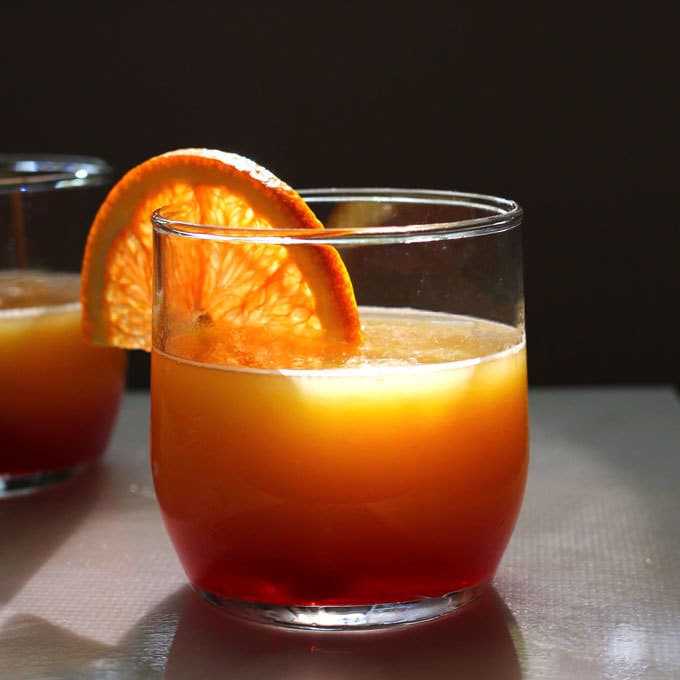 These tequila sunrise slushies are going to be your go-to summer party drink! You can easily multiply the recipe for a pitcher. Only 3 ingredients! | honeyandbirch.com