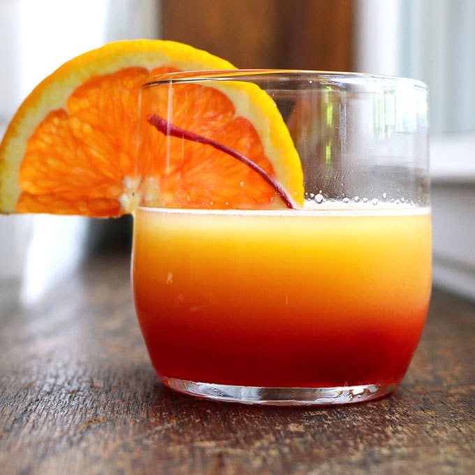 These tequila sunrise slushies are going to be your go-to summer party drink! You can easily multiply the recipe for a pitcher. Only 3 ingredients! | honeyandbirch.com