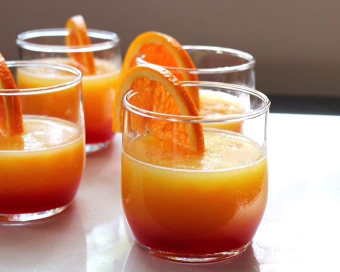 These tequila sunrise slushies are going to be your go-to summer party drink! You can easily multiply the recipe for a pitcher. Only 3 ingredients! | honeyandbirch.com