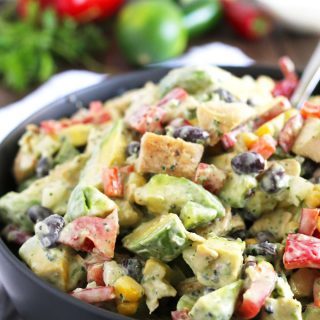 This grilled chicken avocado salad is topped with homemade jalapeno cilantro dressing. It is the perfect easy summer salad and great for quick lunches! | honeyandbirch.com