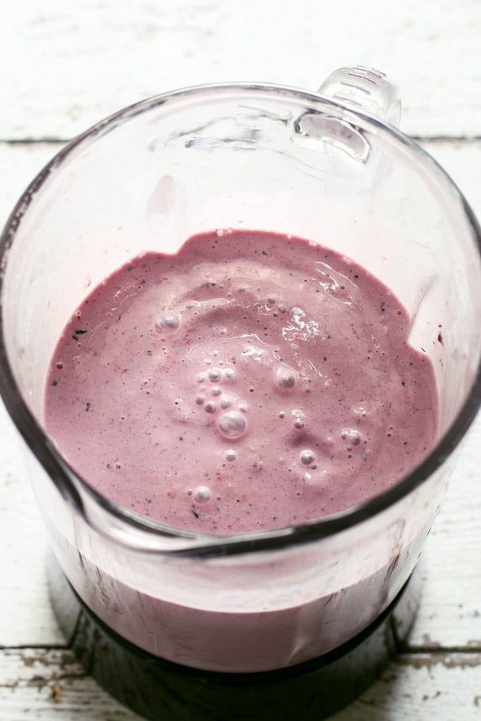 mixed berry milkshake in a blender