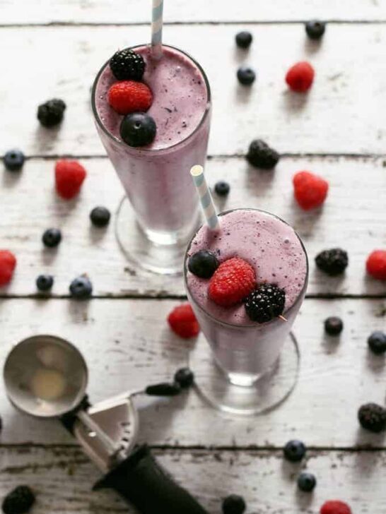 This mixed berry milkshake is easy to make and a great way to use up summer's bounty of berries. You can use any berries you want - raspberries, blackberries, blueberries or strawberries. It will taste delicious each time! | honeyandbirch.com