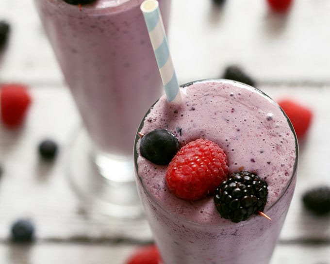 This mixed berry milkshake is easy to make and a great way to use up summer's bounty of berries. You can use any berries you want - raspberries, blackberries, blueberries or strawberries. It will taste delicious each time! | honeyandbirch.com