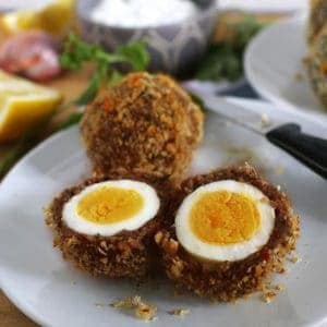 These baked scotch eggs are the perfect party appetizer! Serve them with my shallot yogurt dip; your guests will definitely come back for more! | honeyandbirch.com