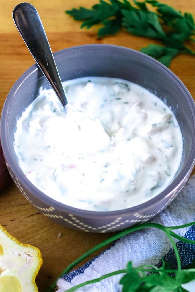 yogurt shallot dipping sauce in a grey bowl