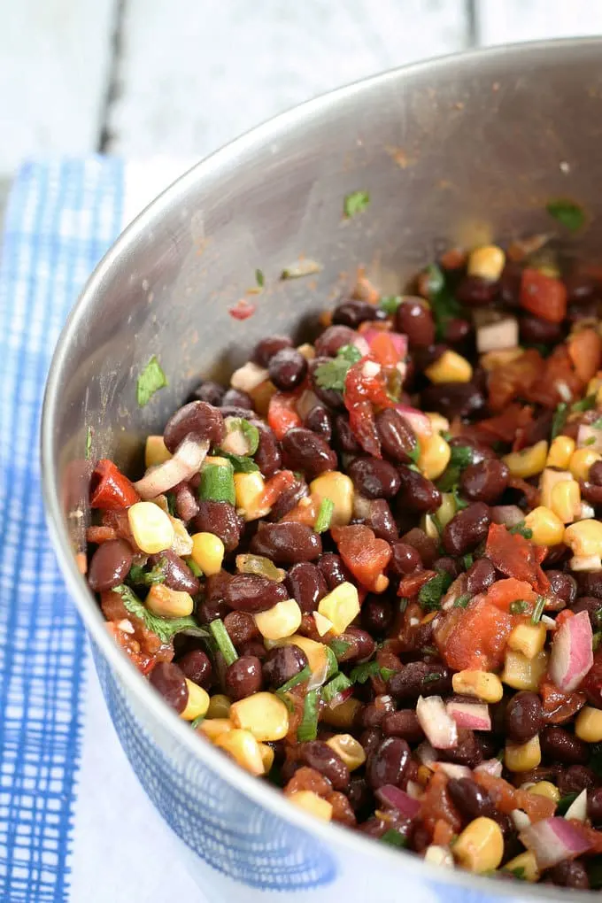 no cook corn black bean salsa in a metal bowl