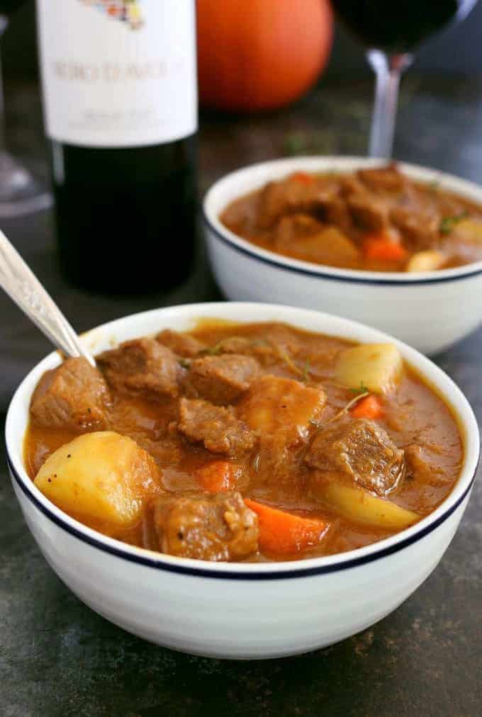 This pumpkin beef stew recipe is the perfect meal for cool autumn nights. It is savory, hearty and guaranteed to warm you up! Pair it with a glass of Nero d'Avola, one of my favorite Sicilian wines. | honeyandbirch.com