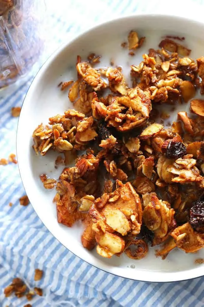Apple cinnamon raisin granola is the perfect homemade snack or breakfast! It's super easy to make and delicious! | honeyandbirch.com