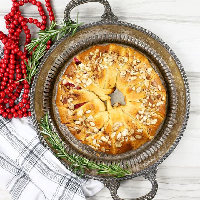 The holidays just got better thanks to this easy cranberry goat cheese crescent ring. It can be an appetizer or dessert recipe - it's the perfect mix of sweet and tart! | honeyandbirch.com