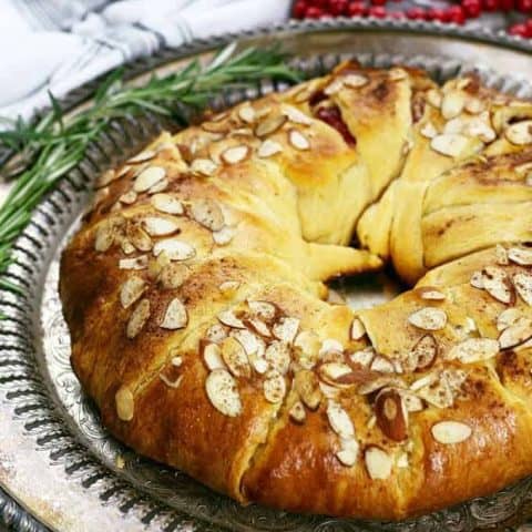 cranberry goat cheese Christmas wreath appetizer on a serving tray