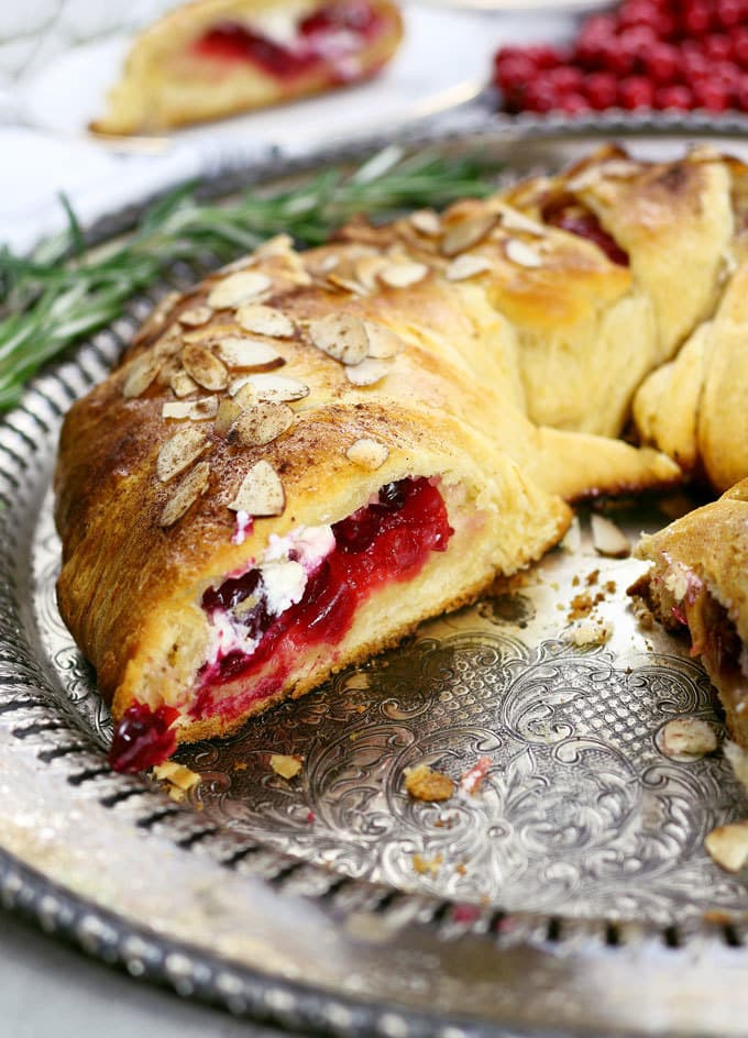 The holidays just got better thanks to this easy cranberry goat cheese crescent ring. It can be an appetizer or dessert recipe - it's the perfect mix of sweet and tart! | honeyandbirch.com