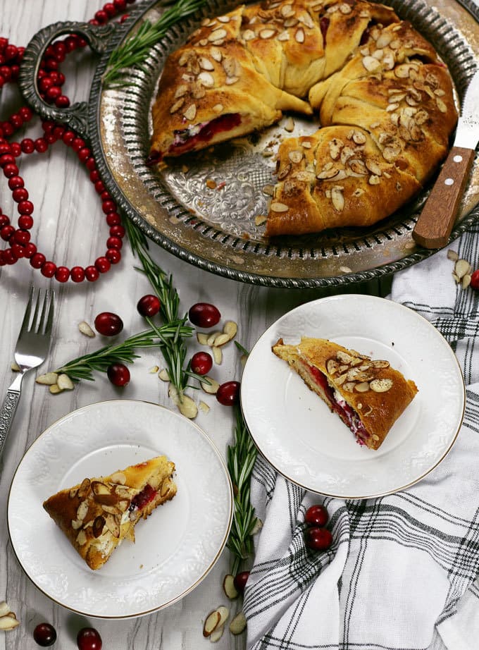 The holidays just got better thanks to this easy cranberry goat cheese crescent ring. It can be an appetizer or dessert recipe - it's the perfect mix of sweet and tart! | honeyandbirch.com