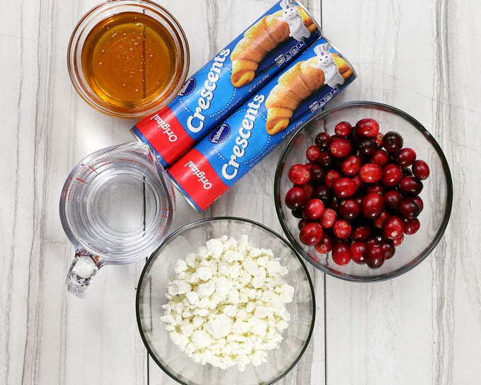 The holidays just got better thanks to this easy cranberry goat cheese crescent ring. It can be an appetizer or dessert recipe - it's the perfect mix of sweet and tart! | honeyandbirch.com