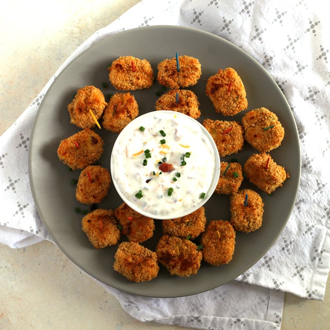 plate of baked loaded mashed potato tater tots