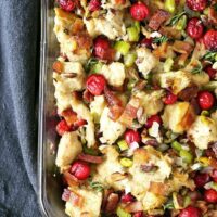 Homemade bacon cranberry pistachio dressing - perfect for Thanksgiving! Whether you put it in the bird (then it's stuffing) or on the side, no holiday meal is complete without it! | honeyandbirch.com