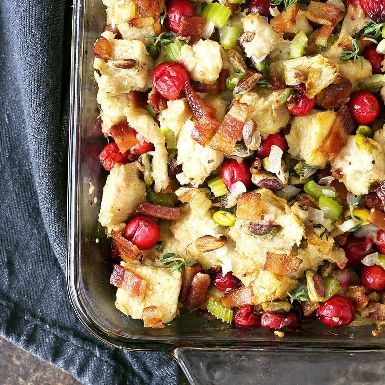 Homemade bacon cranberry pistachio dressing - perfect for Thanksgiving! Whether you put it in the bird (then it's stuffing) or on the side, no holiday meal is complete without it! | honeyandbirch.com