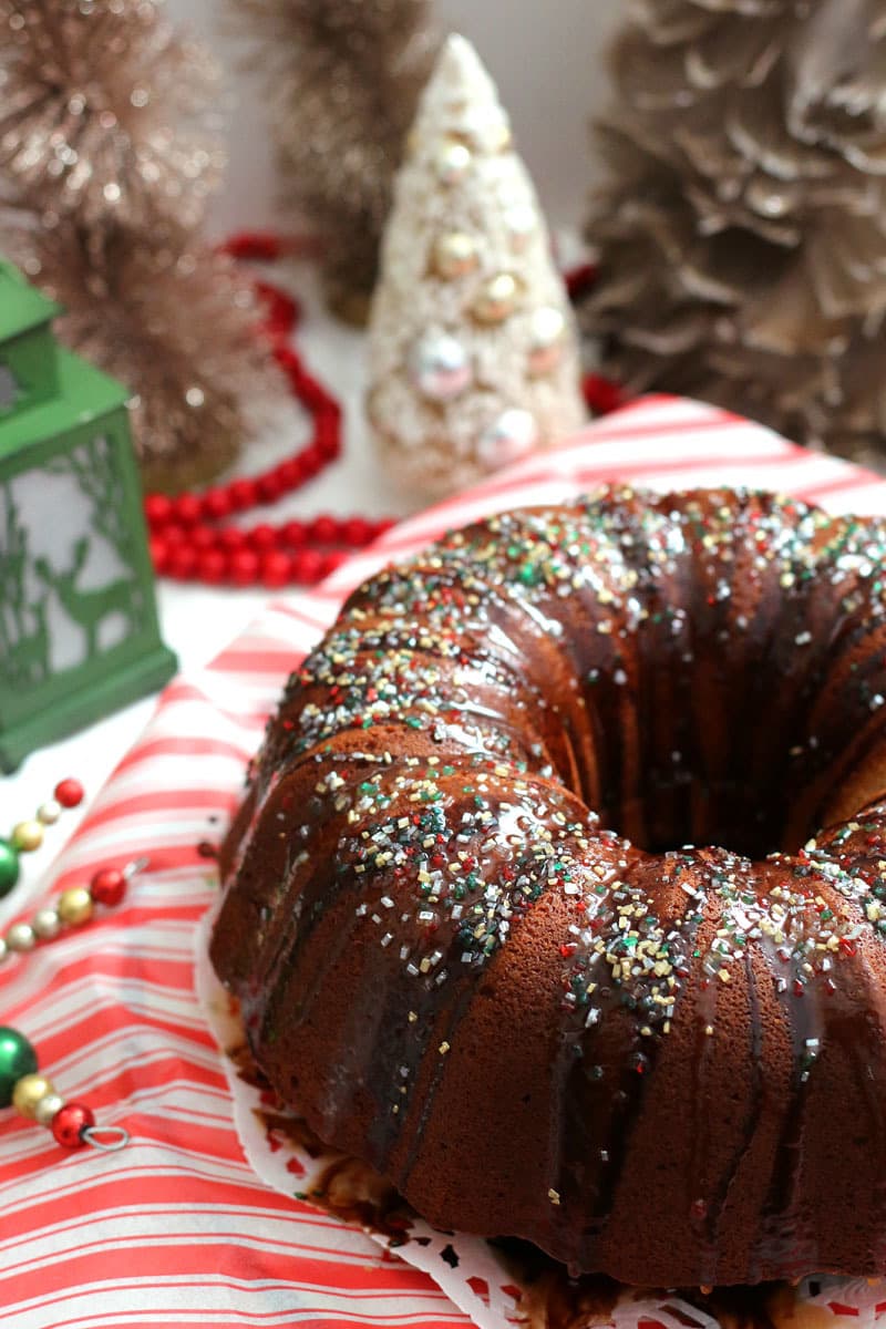 This six egg pound cake is flavored with hot cocoa and covered in chocolate and caramel syrups and sprinkles. Every holiday needs sprinkles.