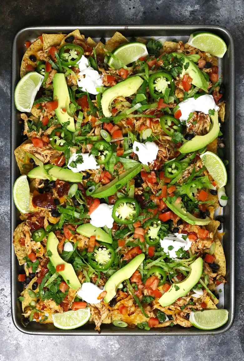 overhead picture of loaded sheet pan chicken nachos