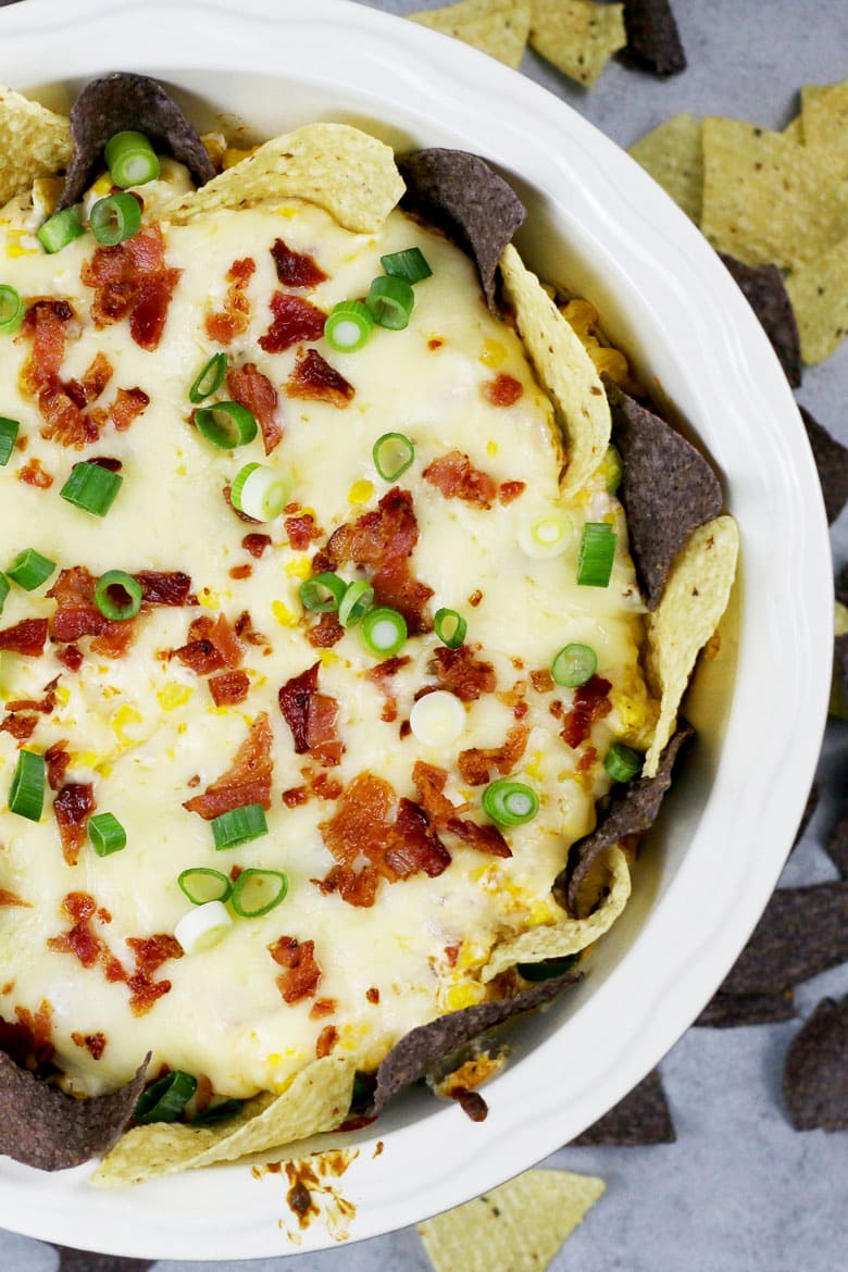 If you like cheese dips, this chipotle bacon corn cheese dip recipe is going to make you so happy! Baked in the oven with three different types of cheese, it's creamy and delicious.