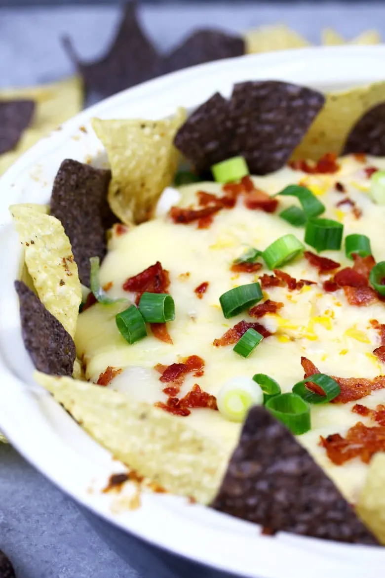 If you like cheese dips, this chipotle bacon corn cheese dip recipe is going to make you so happy! Baked in the oven with three different types of cheese, it's creamy and delicious.