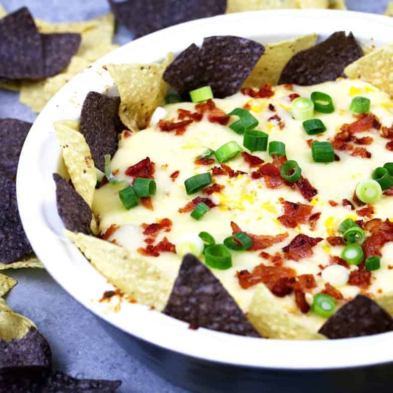 If you like cheese dips, this chipotle bacon corn cheese dip recipe is going to make you so happy! Baked in the oven with three different types of cheese, it's creamy and delicious.