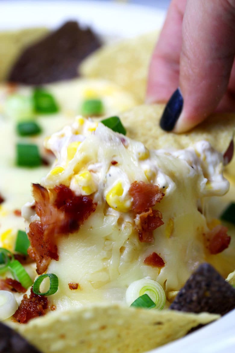 If you like cheese dips, this chipotle bacon corn cheese dip recipe is going to make you so happy! Baked in the oven with three different types of cheese, it's creamy and delicious.