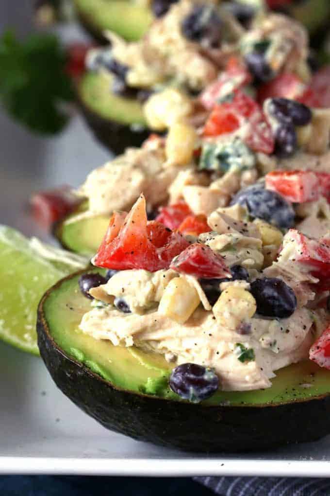 southwest chicken salad stuffed avocados on a plate