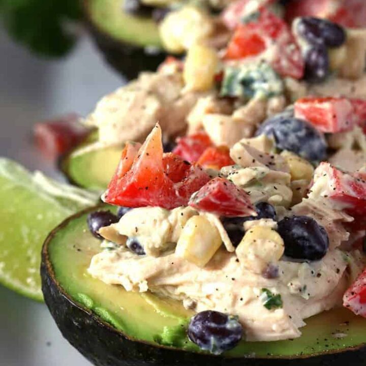 This southwest chicken salad stuffed avocado recipe is perfect for dinners or lunches! Use rotisserie chicken to whip up this healthy meal quickly. | honeyandbirch.com